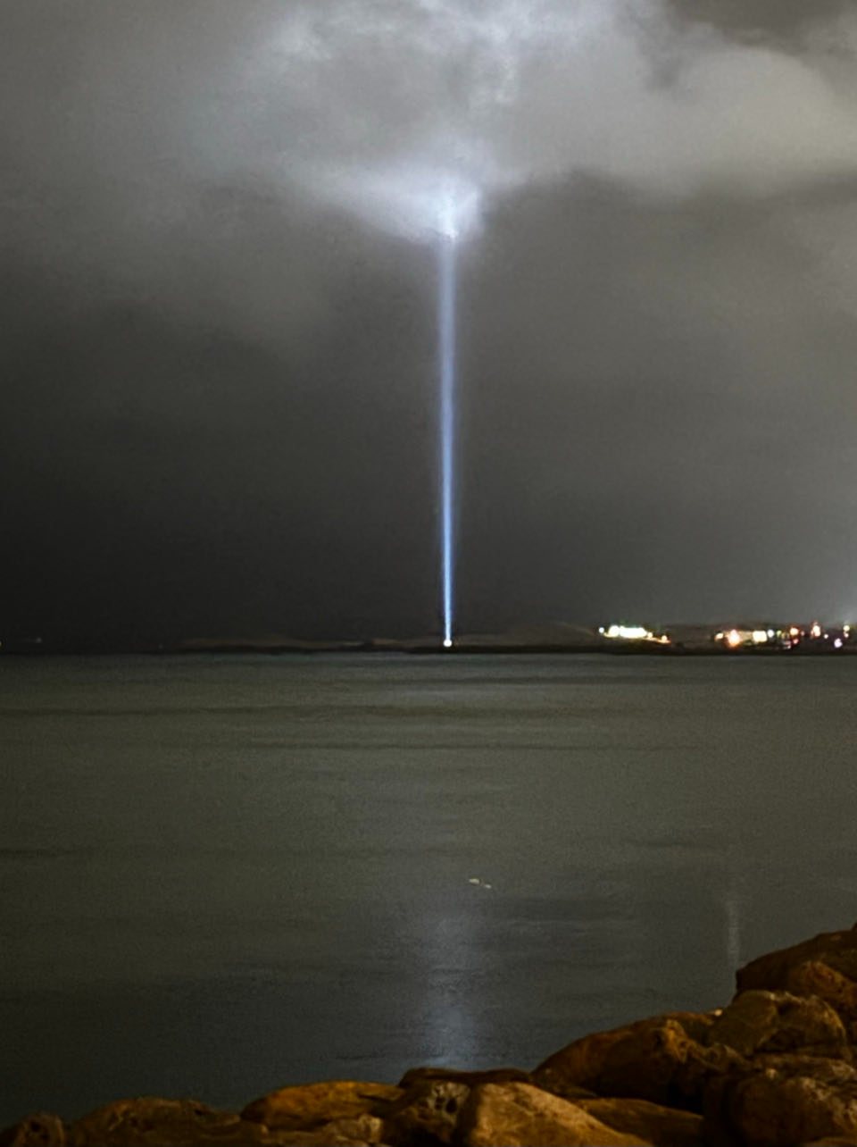 The Imagine Peace Tower lighting the night sky, Reykjavik