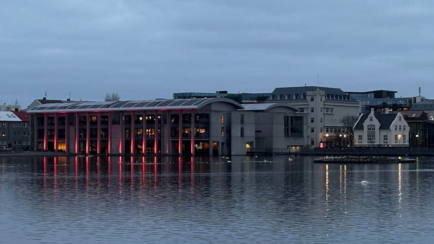 Tjörnin pond and City Hall at dusk, Reykjavik