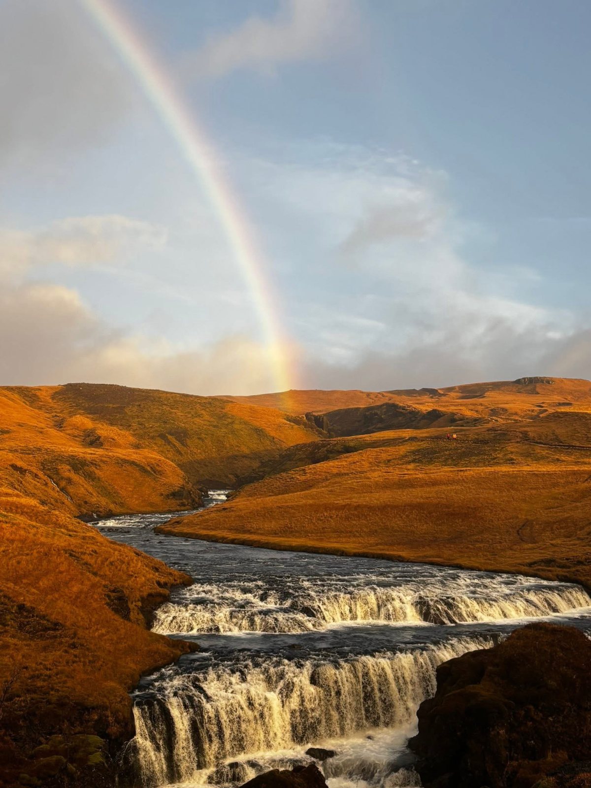 The Skógá river and a rainbow above Skógafoss